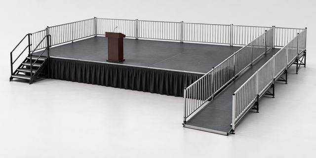 3D render of a black stage with a black skirt, guardrails on three sides, a lectern on the deck, stairs at the left and a long ramp with handrails at the front right