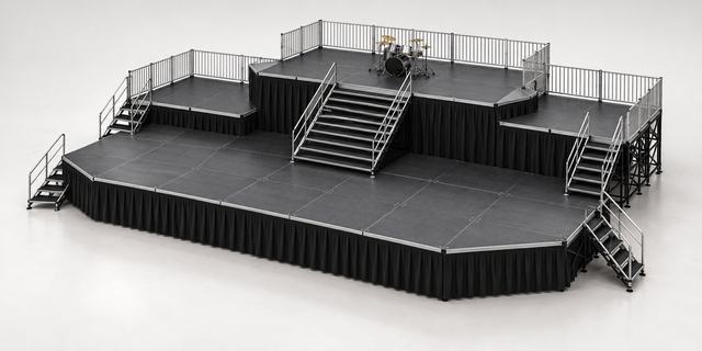 3D render of a black stage with a raised rear deck holding a drum kit, reached by a central stair, lower side decks, guardrails and stairs at both ends
