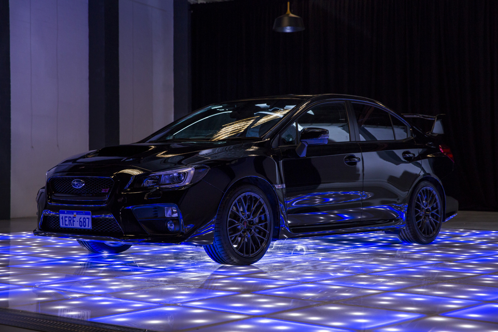 Subaru car on LED dance floor