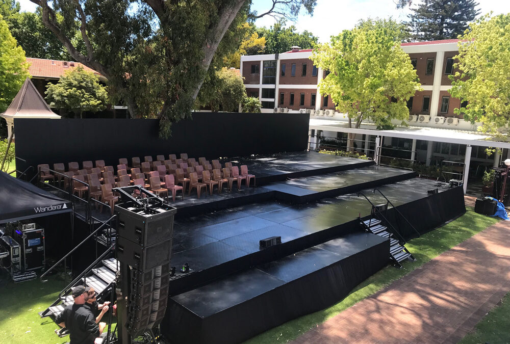 Multi-leveled stage outdoors on uneven ground