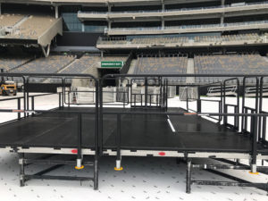 Stage with guard rails