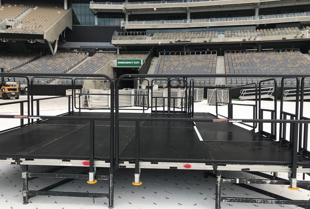 Stage with guard rails