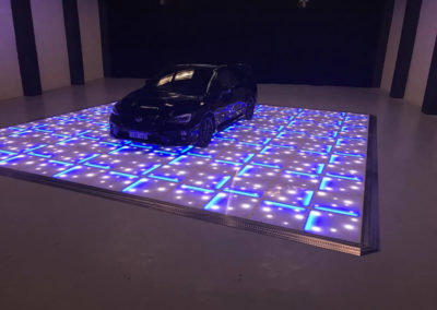 car on dance floor
